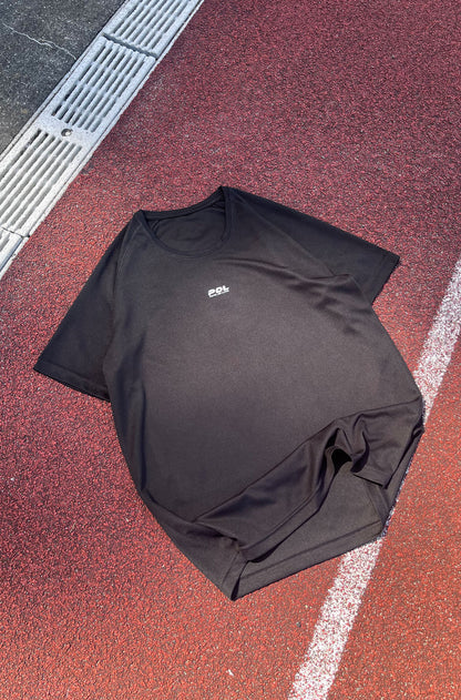 Black t-shirt with a logo on a red and gray surface