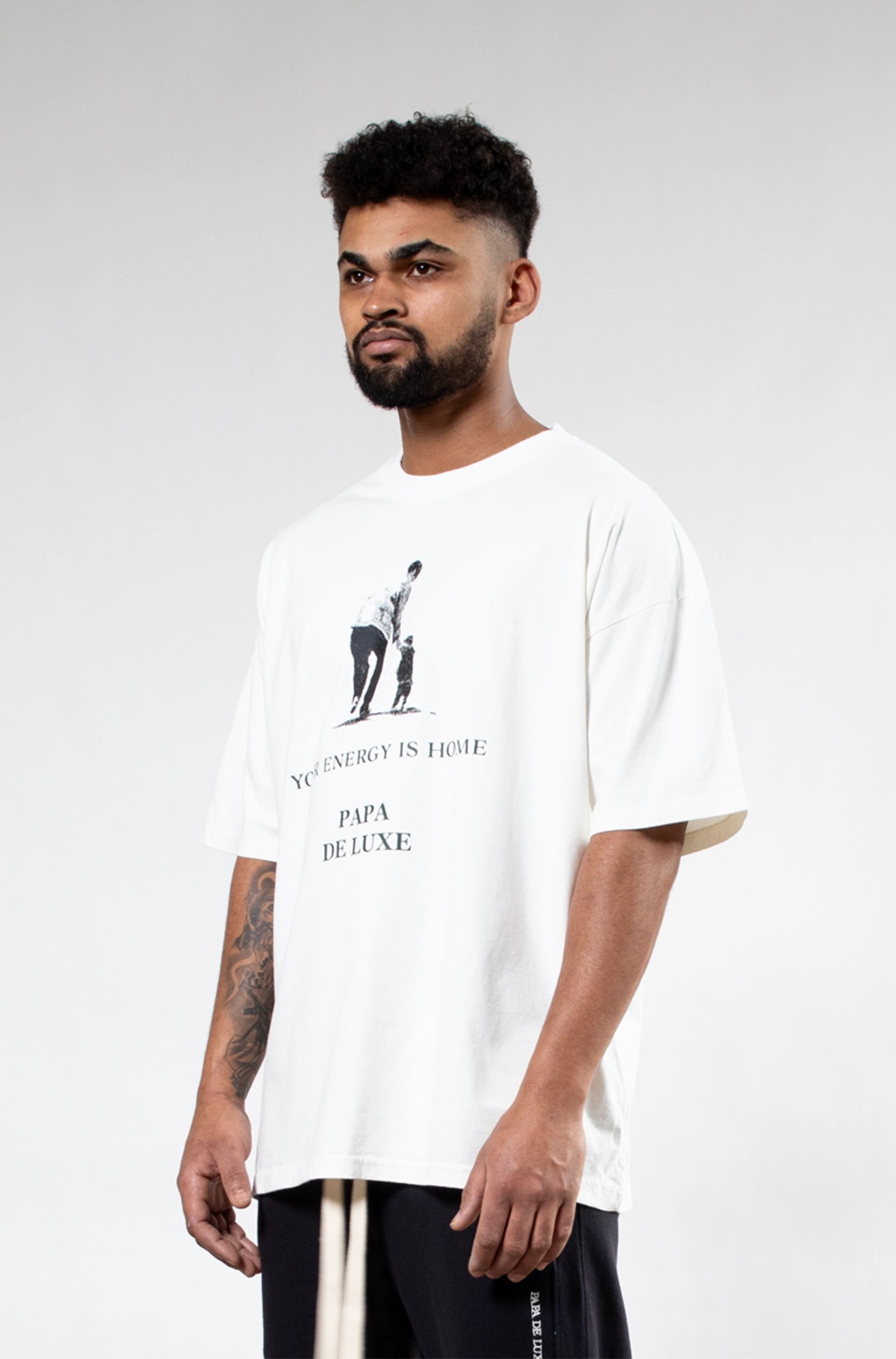 Papa De Luxe 'Your Energy Is Home' T-shirt side close-up refined neckline and single-jersey cotton fabric detail
